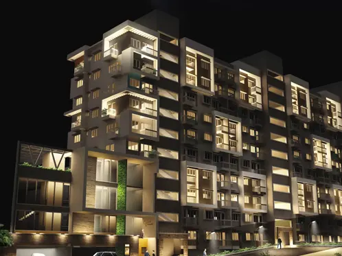 Night view of MJR Platina apartment building with illuminated balconies and modern architecture