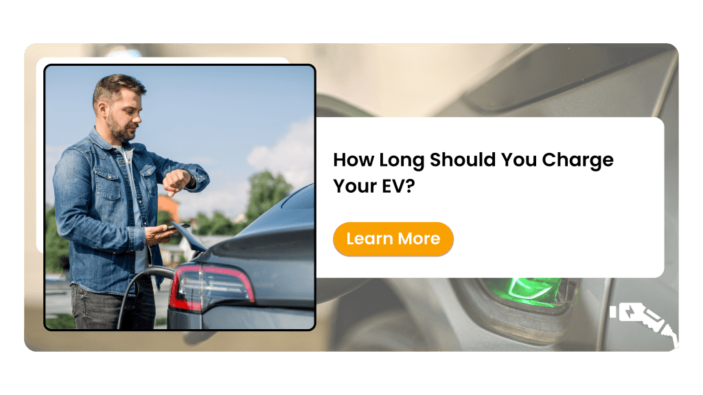 A man checking his watch while charging an electric vehicle at a public charging station, representing EV charging time considerations.